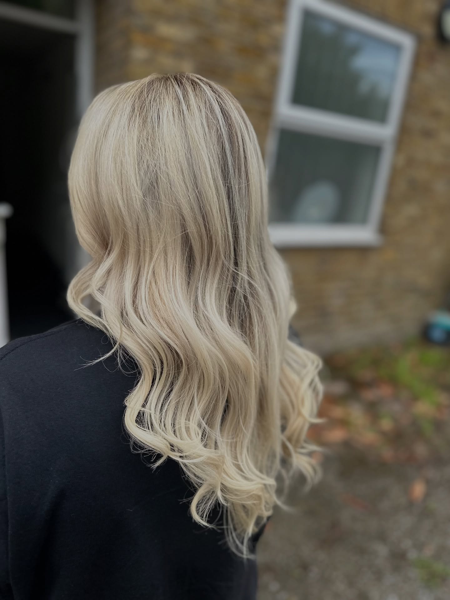 Soft blonde waves by Vanda Hairdresser in London
